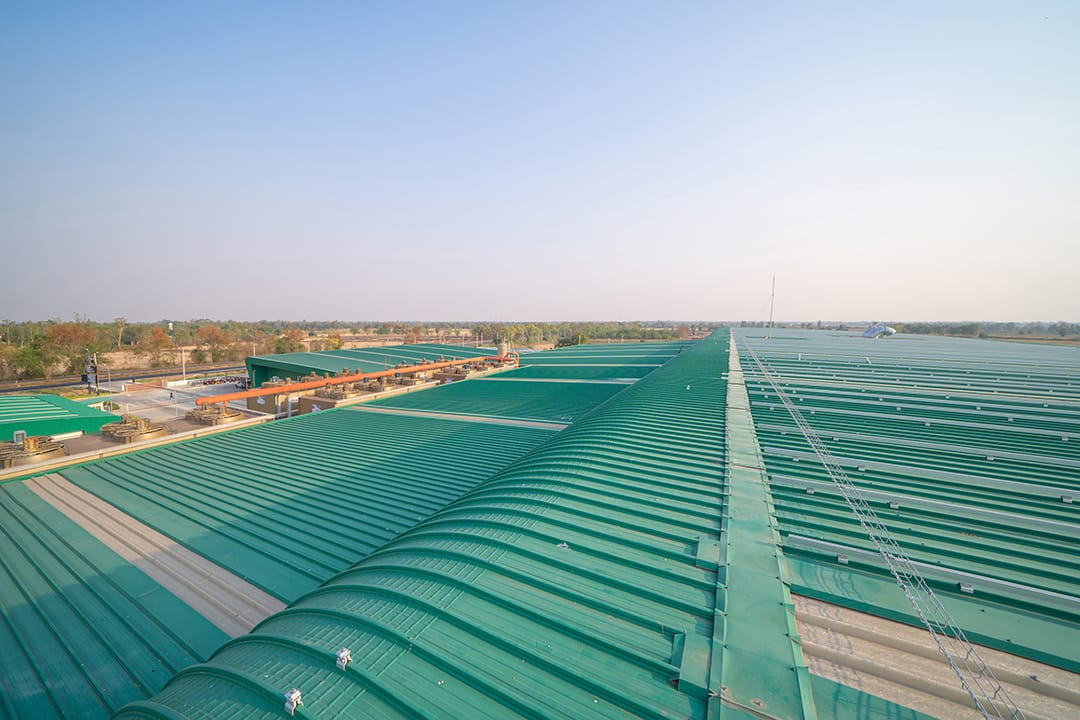 Empty space of metal sheet corrugated roof on rooftop of industry factory. Steel structure of modern station building roof. Metal. architecture design background. Commercial Metal Roof