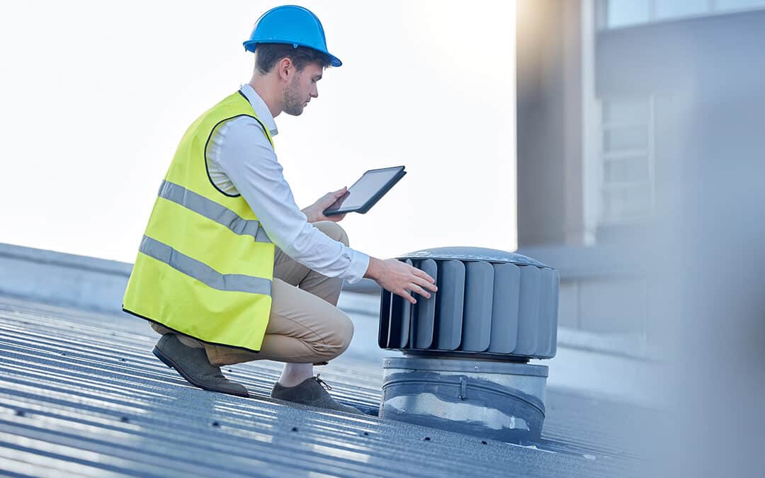 Construction worker wearing PPE woking at roof