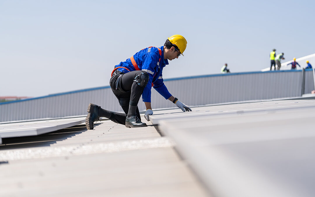 Engineer inspects on the roof of factory. Commercial Roof Maintenance